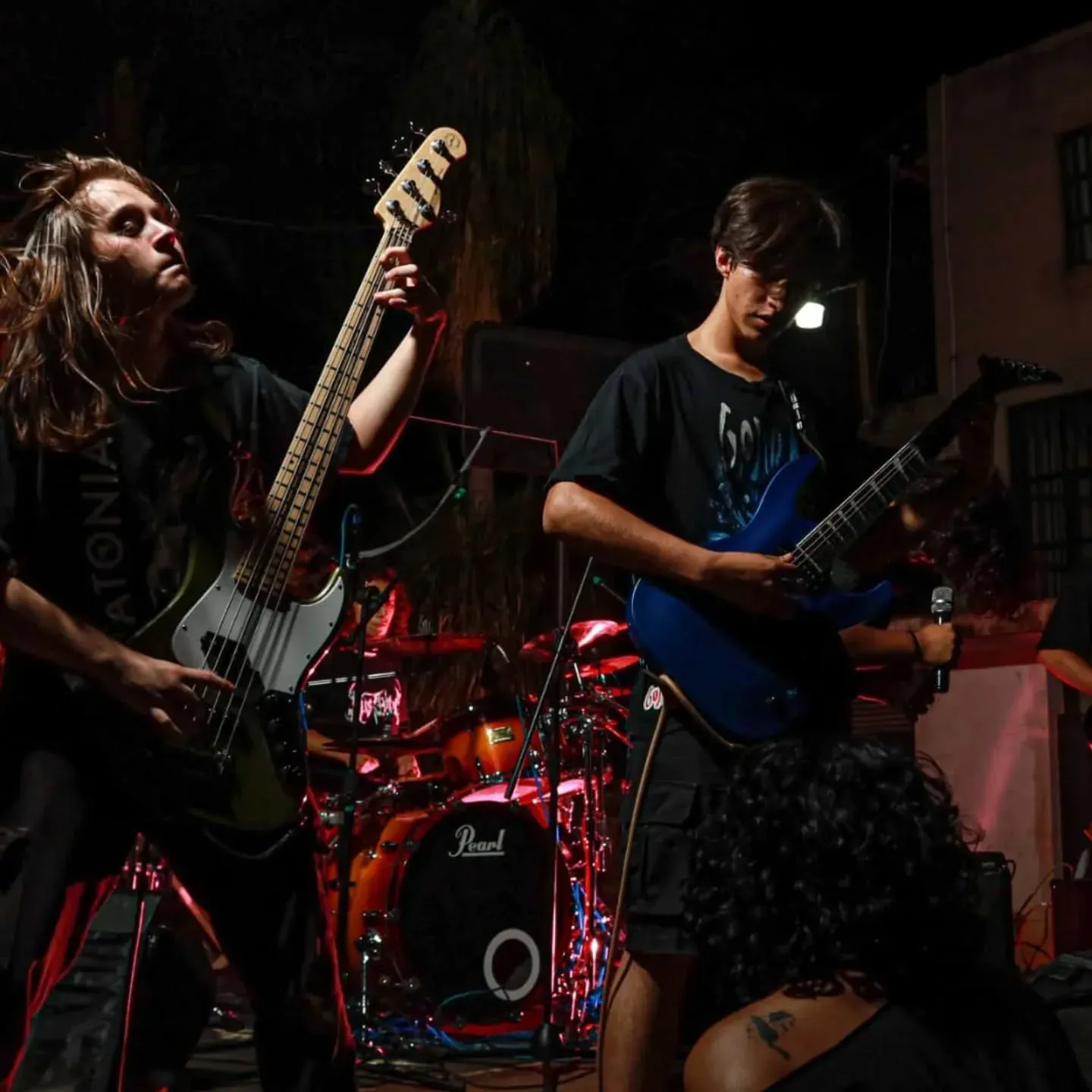 Rustblood bass and guitar under red stage lights