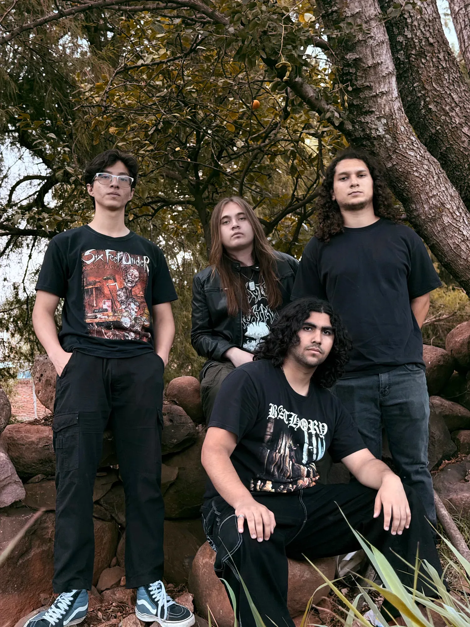 Rustblood band photoshoot among rocks and trees
