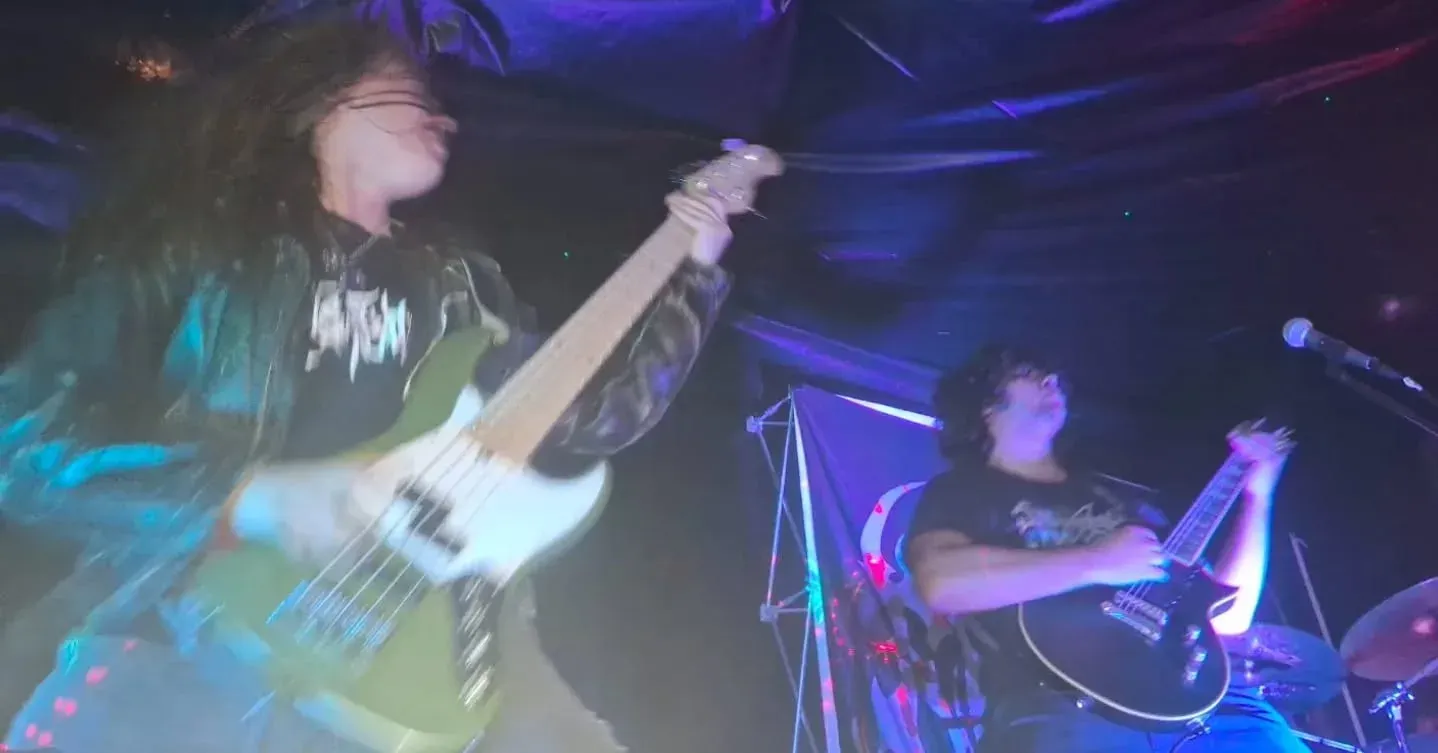 Rustblood bass and guitar mid-song at a club show