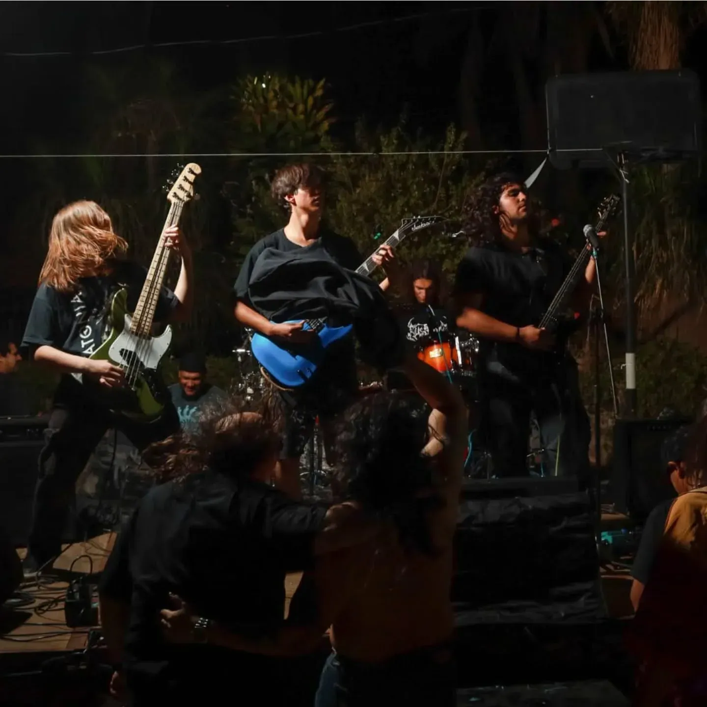 Rustblood playing an open-air night show